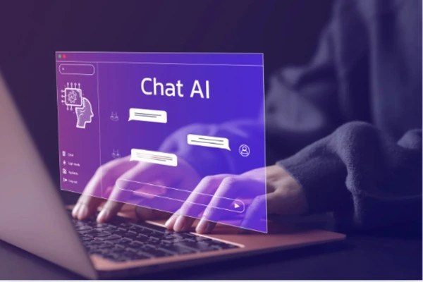 A person typing on a laptop with a holographic interface displaying Chat AI, illustrating the role of AI in small business communication and customer interaction.